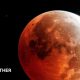Full moon with a red tinge over the majority of the Moon
