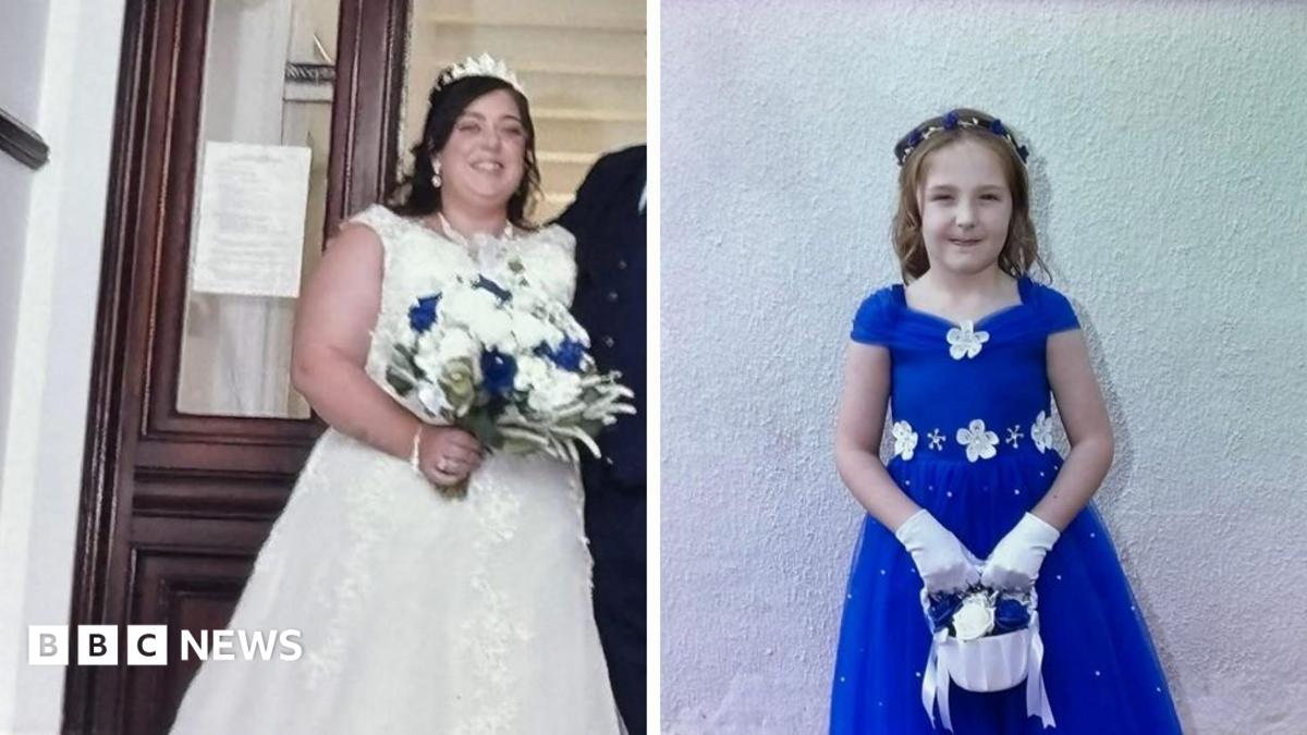 A composite image of Natalie McDonald and Valentina Foster. McDonald is wearing a white wedding dress with a tiara perched on her head. She has long dark hair and is holding a bouquet of white roses with four blue ones dotted within it. Valentina wears an electric blue dress with white flowers on the neckline and waist. She has long light brown hair with a blue and white headband. She is holding a small white basket with white and blue roses and she wears white gloves.