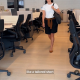 screenshot from NYT video on "how to elevate a basic white tee"; she is wearing tailored shorts and a sweater wrapped around her waist