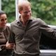 Prince Harry and Meghan waving as they arrive at the Australian National Veterans Arts Museum in Melbourne, Australia on 14 April 2026.
