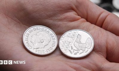 New 10p coin in the palm of someone's hand with one coin on the side showing an image of King Charles and dated 2026, with another coin on the reverse side showing a capercaillie.
