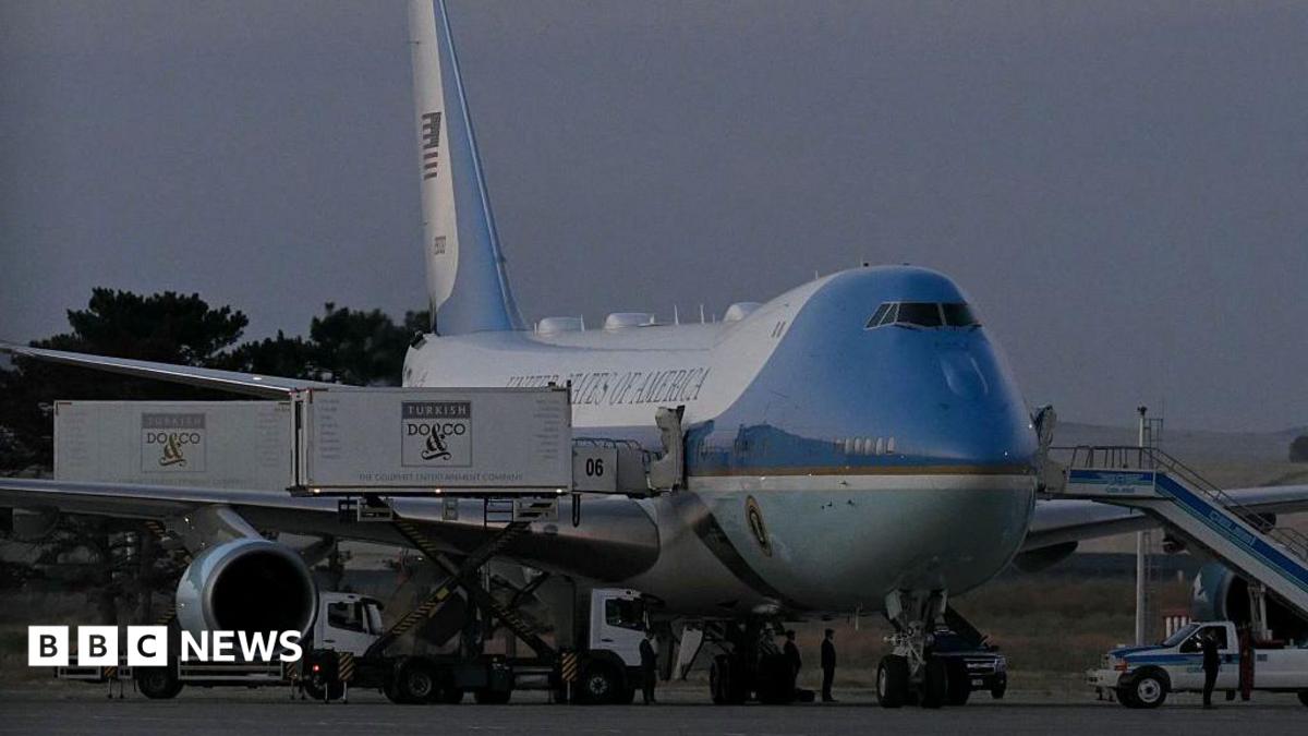 A catering truck parked alongside the old Air Force One jet prior to departure from Ankara