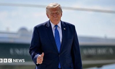 U.S. President Donald Trump gives thumbs-up as he walks from Marine One to board Air Force One.