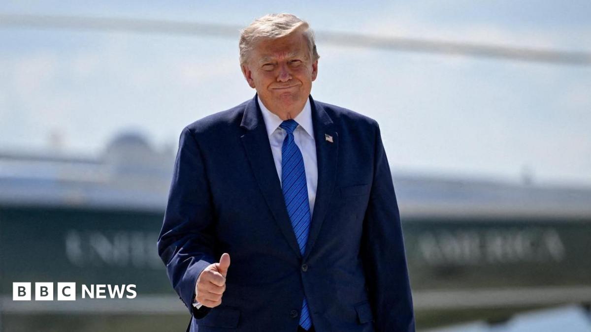 U.S. President Donald Trump gives thumbs-up as he walks from Marine One to board Air Force One.