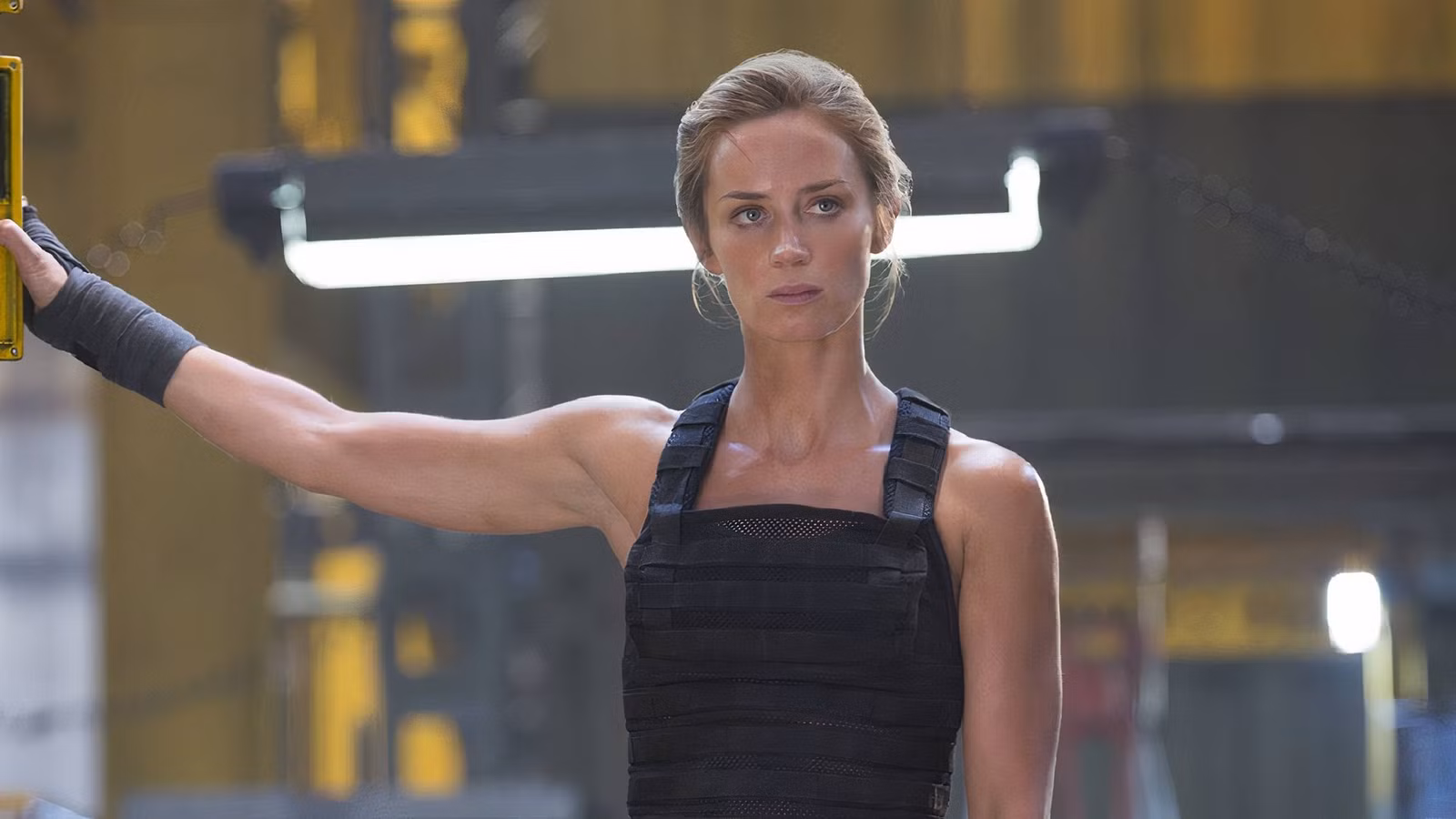Emily Blunt as Rita Vrataski turning off a machine in Edge of Tomorrow.