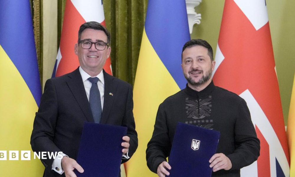 Ukrainian President Volodymyr Zelensky (R) and Prime Minister of Britain Andy Burnham (L) pose as they attend a signing documents ceremony during their meeting at the Presidential office in Kyiv, Ukraine, 24 August 2026, amid the ongoing Russian invasion.