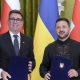 Ukrainian President Volodymyr Zelensky (R) and Prime Minister of Britain Andy Burnham (L) pose as they attend a signing documents ceremony during their meeting at the Presidential office in Kyiv, Ukraine, 24 August 2026, amid the ongoing Russian invasion.