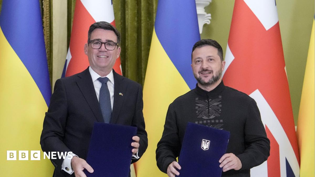 Ukrainian President Volodymyr Zelensky (R) and Prime Minister of Britain Andy Burnham (L) pose as they attend a signing documents ceremony during their meeting at the Presidential office in Kyiv, Ukraine, 24 August 2026, amid the ongoing Russian invasion.