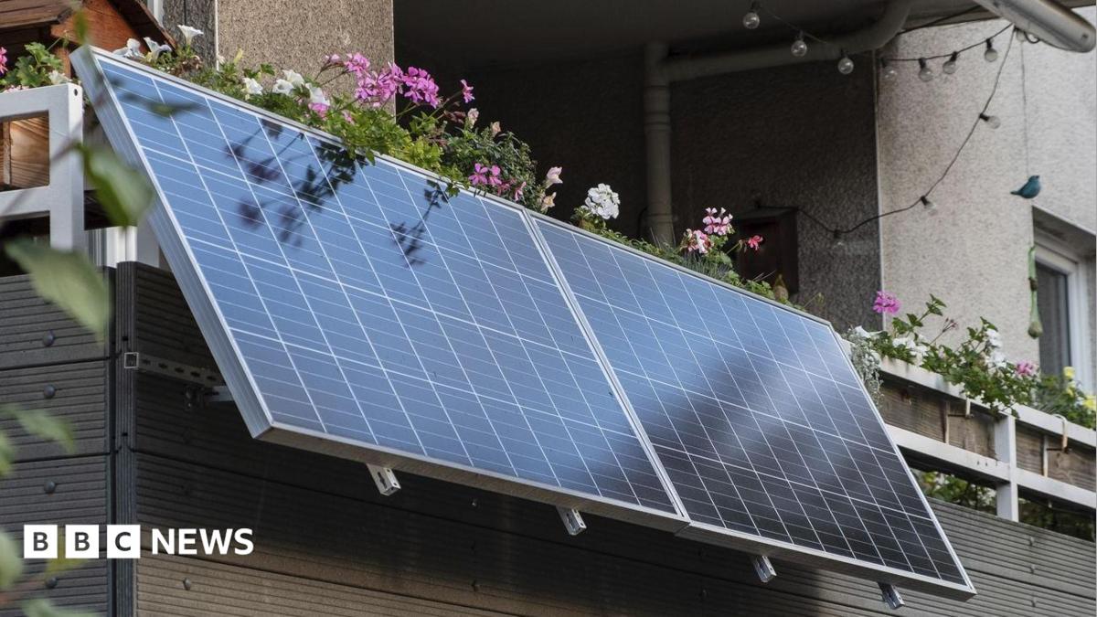 Infographic showing how plug-in solar panels work. A solar panel outside a house converts sunlight into direct current (DC) electricity, which passes through a microinverter that converts it to alternating current (AC). An AC cable then plugs into a standard household socket to help power the home.
