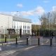 The Elbit Systems UK factory in Filton, near Bristol. There are metal gates blocking access to the building, which is white and grey.