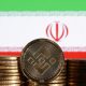 Illustration shows representations of cryptocurrency Binance and Iran flag