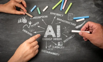 Chalkboard Illustration of AI Energy Needs with Hands Holding Colored Chalk