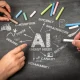 Chalkboard Illustration of AI Energy Needs with Hands Holding Colored Chalk