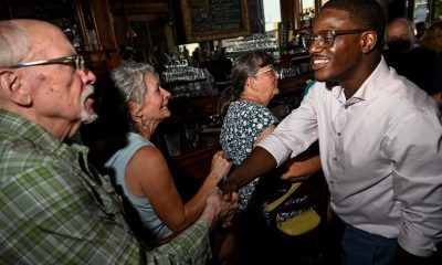 Wisconsin gubernatorial candidate David Crowley greets people during a campaign stop at Urbane restaurant in Sheboygan, Wisconsin, on Aug. 7, 2026.