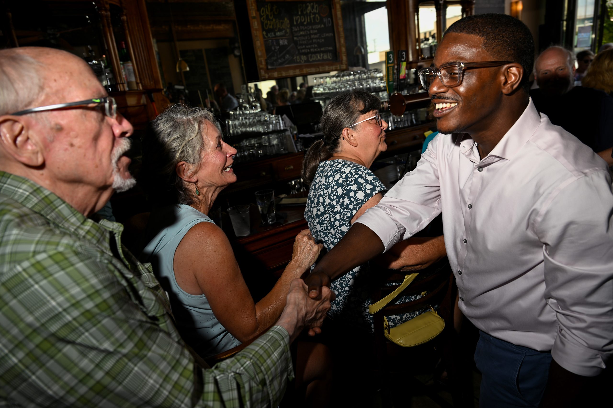 Wisconsin gubernatorial candidate David Crowley greets people during a campaign stop at Urbane restaurant in Sheboygan, Wisconsin, on Aug. 7, 2026.