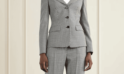 woman wears black and white checked suit