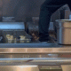 Video captures Panda Express worker standing near fryer during meal prep