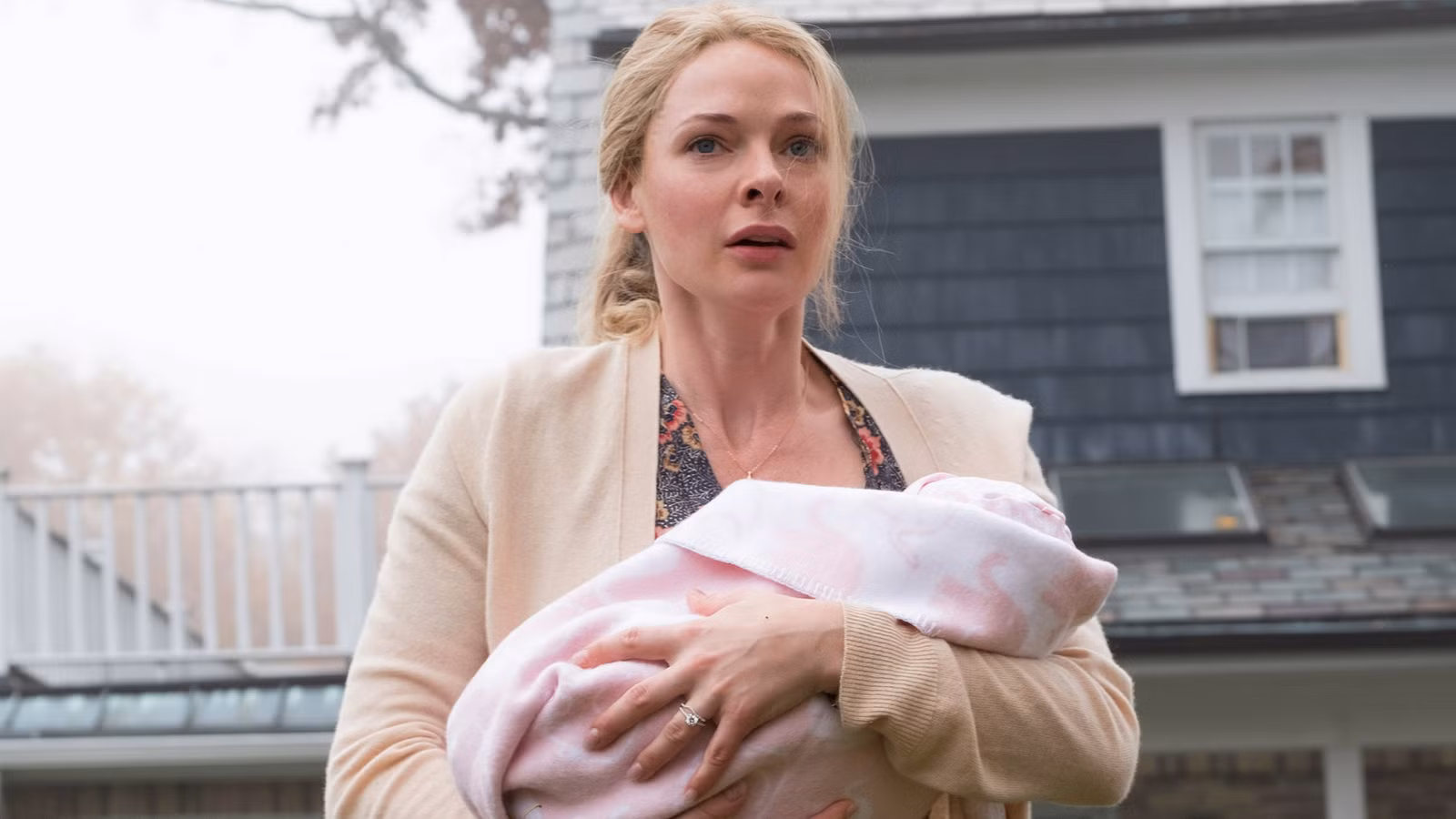 Rebecca Ferguson holding a baby in 'The Girl on the Train'