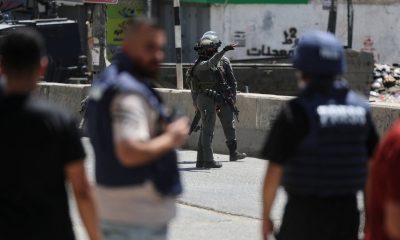 Israeli forces take part in a raid on the Qalandia training centre. Pic: Reuters