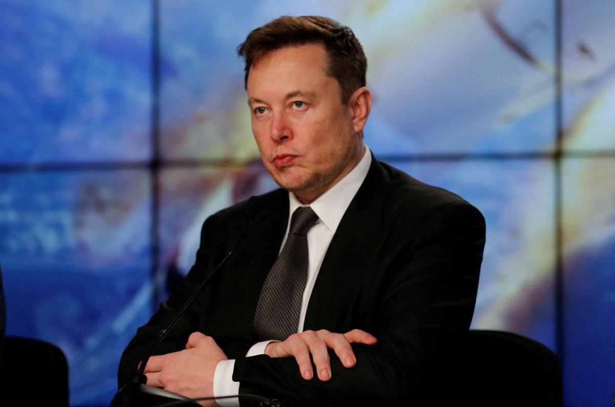 SpaceX founder and chief engineer Elon Musk reacts at a post-launch news conference to discuss the  SpaceX Crew Dragon astronaut capsule in-flight abort test at the Kennedy Space Center