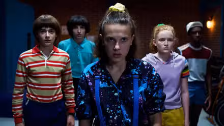 Stranger Things Season 3, Episode 4 cast of kid characters staring ahead somberly.