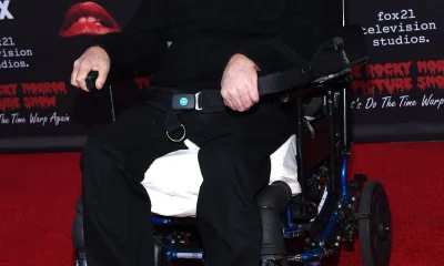 Tim Curry in a wheelchair