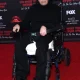 Tim Curry in a wheelchair