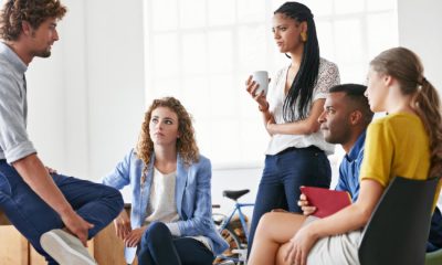 a group of young coworkers have a meeting