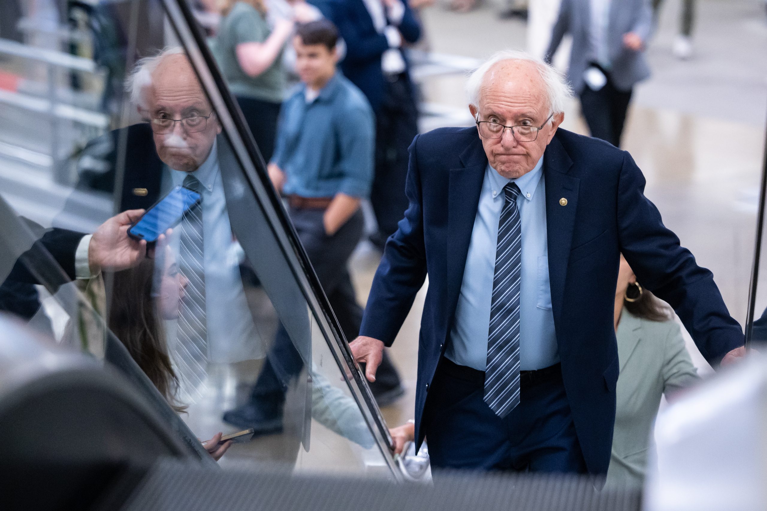 Sen. Bernie Sanders (I-Vt.) ascends on an escalator on his way to a vote at the U.S. Capitol in Washington, on July 30.