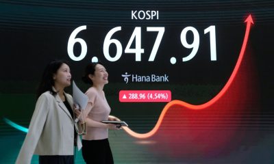 Asian shares rally as hopes for Mideast deal, AI rebound and strong profits push stocks to records