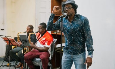 Suspended priest turns to calypso to preach about sexual abuse and Gaza