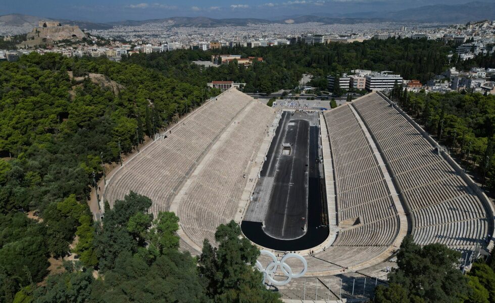 Under the dirt, a gleaming Olympic icon: Greece's marble stadium gets a deep clean