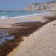 Ship attacked in Hormuz strait as Iran throttles traffic through key waterway