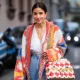 MILAN, ITALY - FEBRUARY 21: Bettina Looney is seen wearing two tone denim jeans, Fendi bag, cardigan outside Vivetta on Day 2 Milan Fashion Week Autumn/Winter 2019/20 on February 21, 2019 in Milan, Italy. (Photo by Christian Vierig/Getty Images)