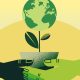 Hands holding earth plant