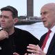 John Healey makes a point with his hands to a thoughtful looking Andy Burnham, who is gazing out across the Mersey river on a ferry in Liverpool