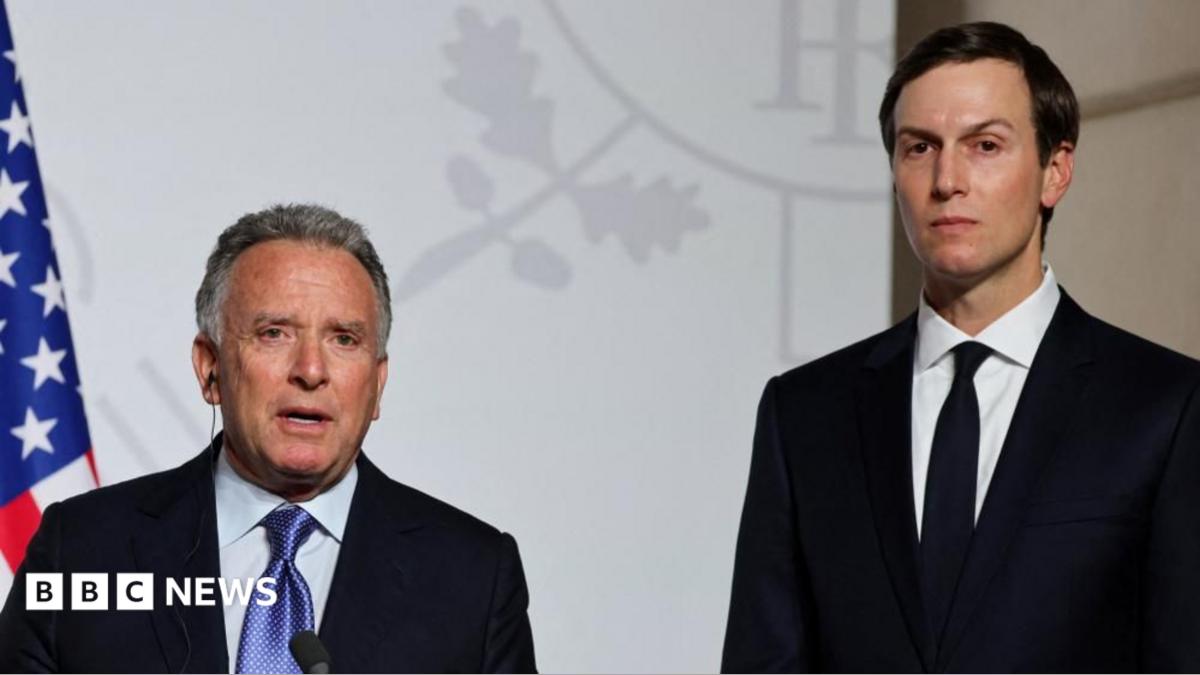 Steve Witkoff (left) and Jared Kushner (right) stand side by side looking directly towards the camera. They are both in black suits with white shirts. Witkoff has a blue patterned tie and Kushner has a black tie