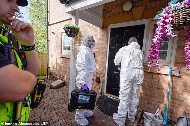 A police forensics team could be seen entering the property on Monday as detectives continued to question seven people on suspicion of murder