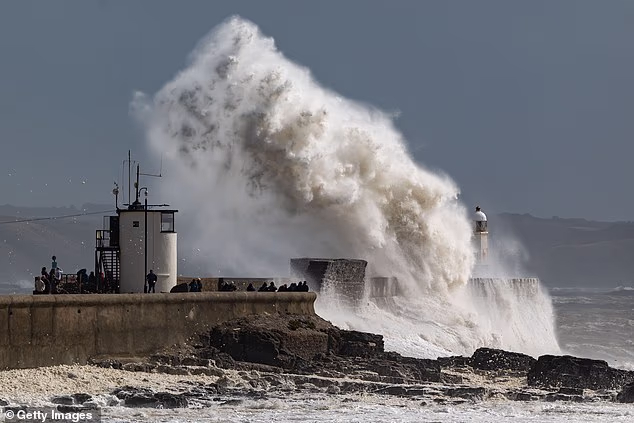 The Met Office has unveiled the official list of storm names for the 2026-27 season – including tributes to loved ones, favourite pets and even an animated sheep. Pictured: Waves batter Porthcawl, Cornwall during Storm Amy last year