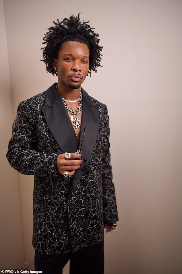 A day after his attorneys quit his defense and left a public defender to represent him, TMZ reported that D4vd's father Dawud Burke sold a home in Texas for more than $225,000 and took out a loan on another home for $138,000; D4vd is pictured in June 2025 in Paris