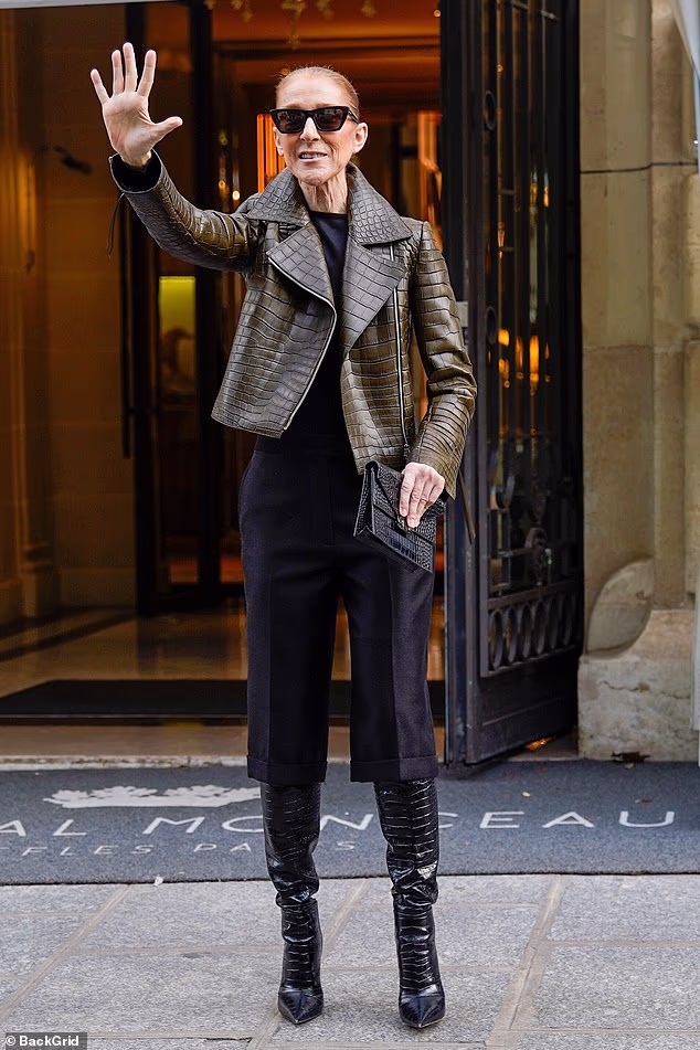 Celine Dion looked in great spirits as she waves to fans while leaving her hotel in Paris on Monday ahead of her stage comeback