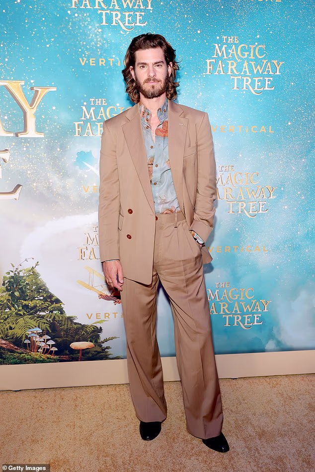 Andrew Garfield is standing by his 2013 call for a gay Spider-Man saying that he still believes the Marvel superhero is beloved by fans because he is an inclusive character. Above, in July