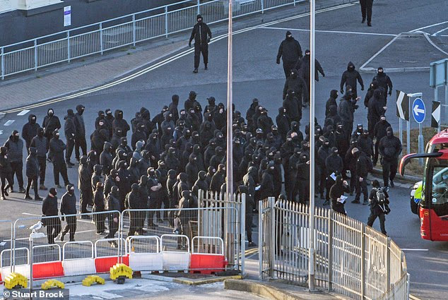 Balaclava-clad protesters have blocked roads leading to the Port of Dover in a suspected anti-migrant demonstration, sparking warnings of delays for holidaymakers