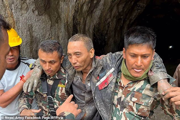 Pictures show rescuers carrying a Chinese national (centre) found in the Upper Trishuli-1 Hydropower Project