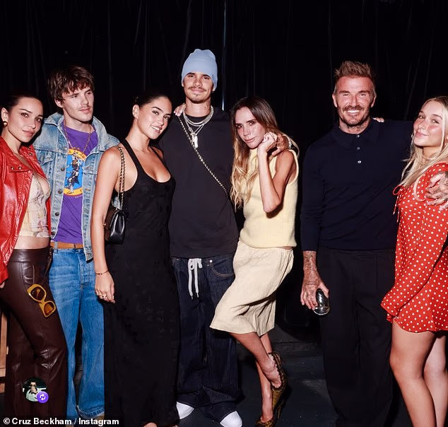 Cruz Beckham takes a fresh jibe at Brooklyn as he shares cosy family snap from his show at Leeds Festival - just hours after his estranged brother supported his wife Nicola Peltz after her Venice Film Festival debut