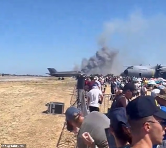 Footage shared on X shows smoke billowing into the sky as a horrified crowd watches on