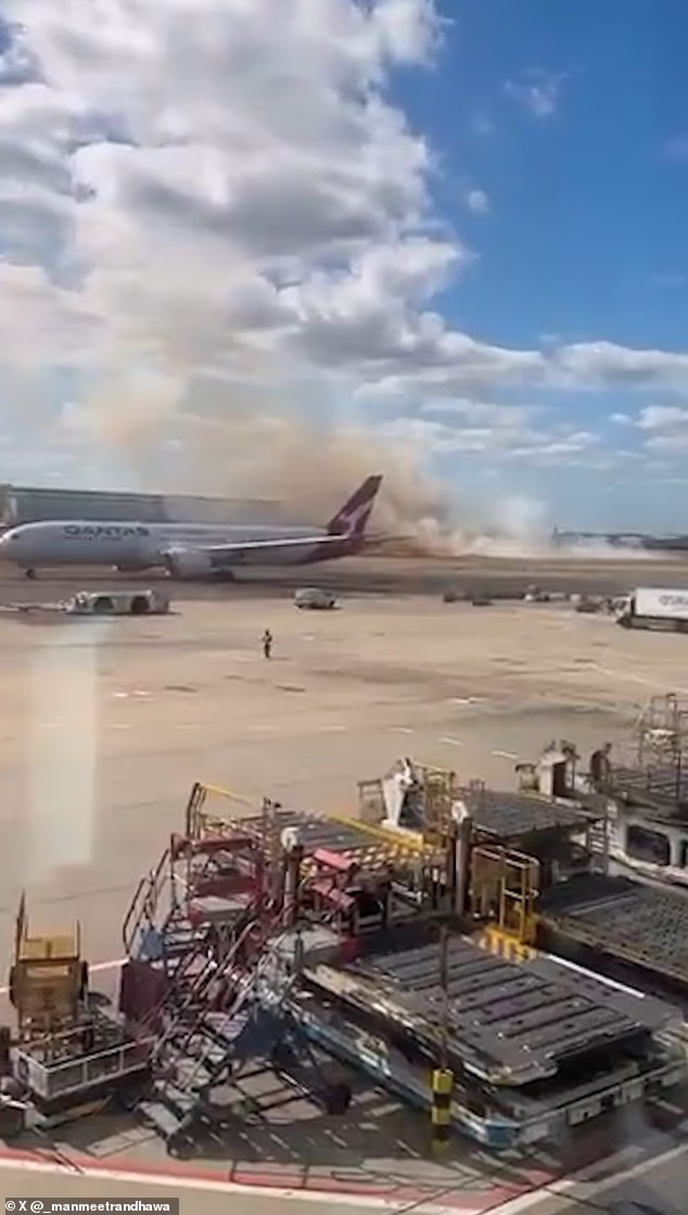 Video footage shows plumes of smoke drifting across Heathrow's southern runway near a Qantas passenger jet