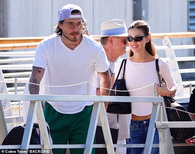 Brooklyn Beckham and wife Nicola Peltz couldn't wipe the smiles off their faces as they made a low-key departure from Venice Film Festival on Sunday