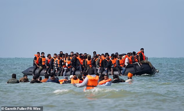 Migrants off Equihen-Plage south of Boulogne during a cross-Channel attempt in July