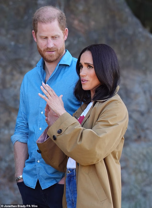 Laurence Llewelyn-Bowen said new Cotswolds resident Meghan Markle should emulate down-to-earth Kate Middleton to win over the locals and says 'we're very down and dirty here'